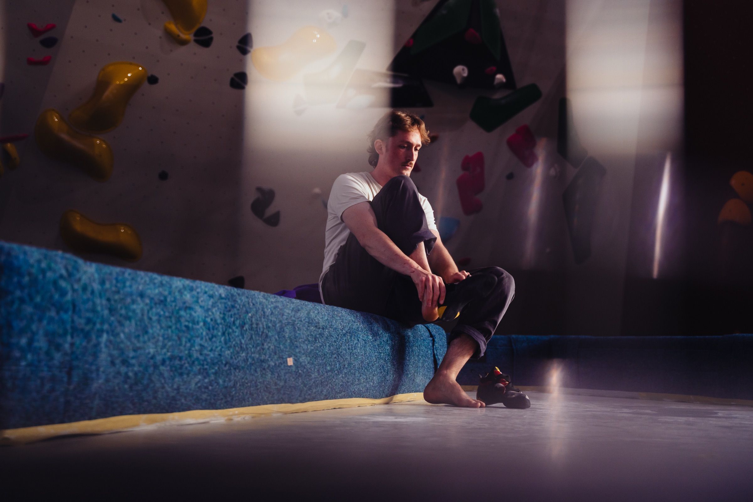 Close-up of a climber’s shoes on small holds