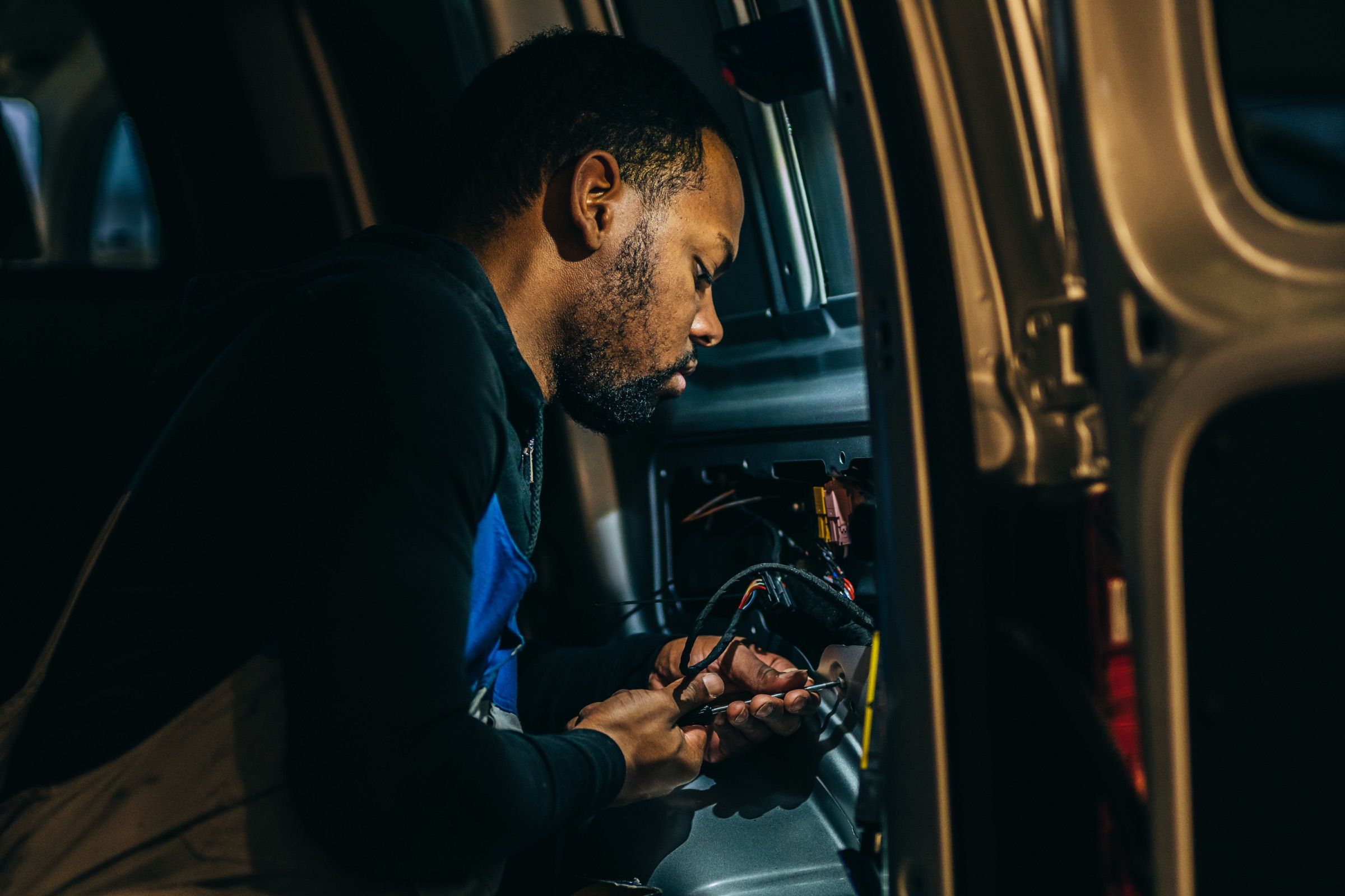 Portrait of a technician at work on a vehicle