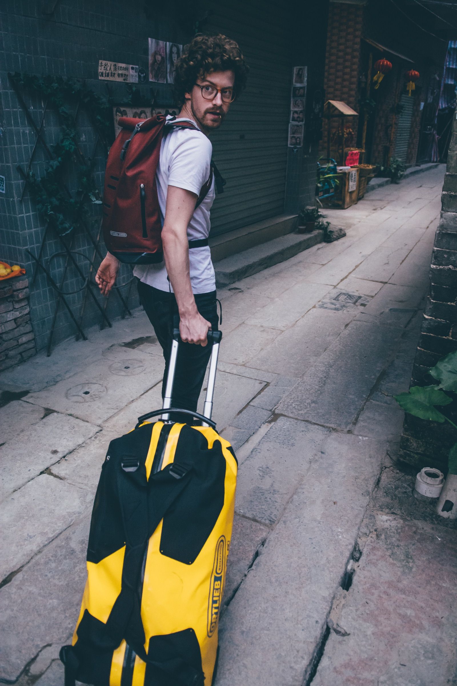 Traveler commuting through the city with an Ortlieb backpack