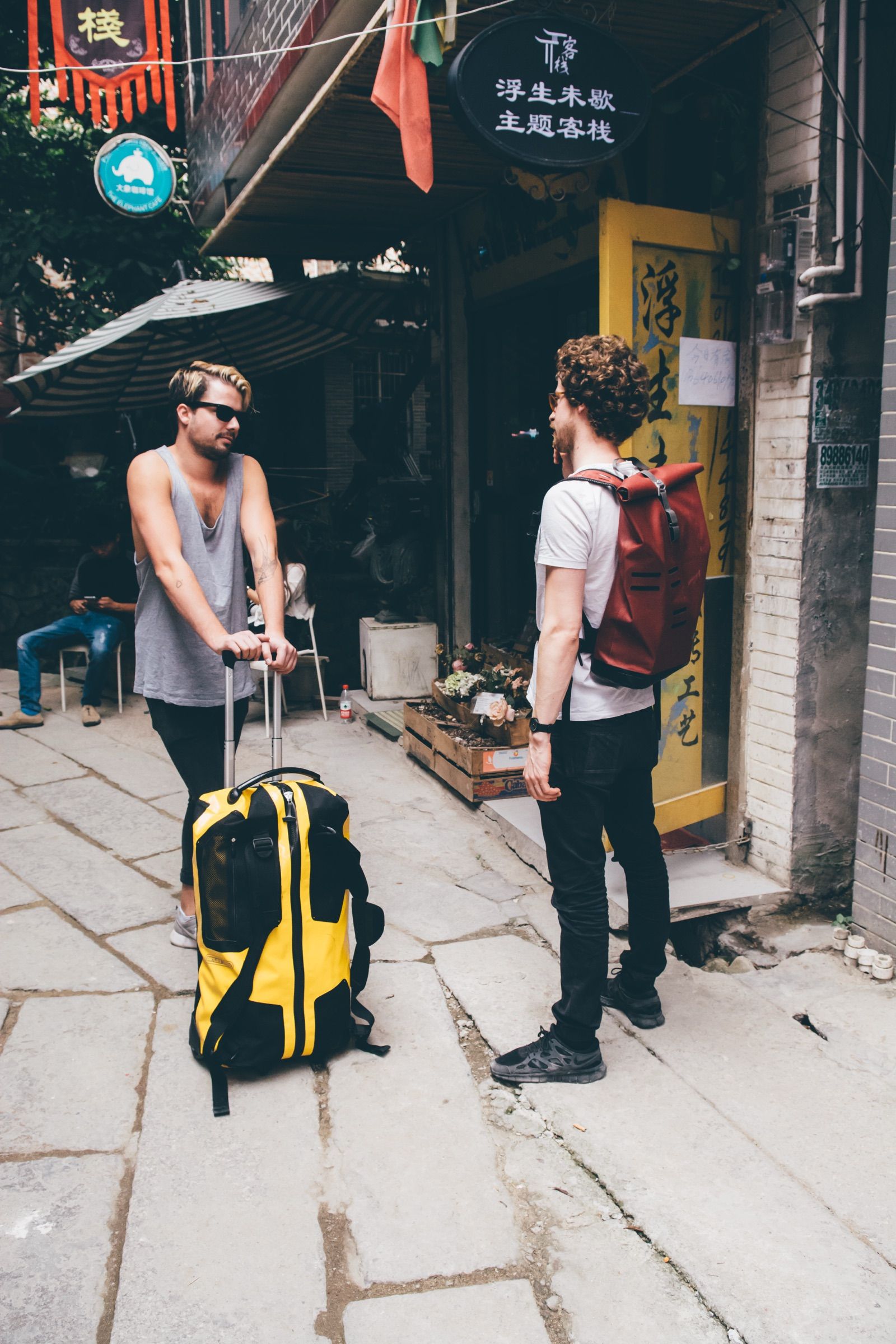 Traveler with an Ortlieb backpack among city crowds