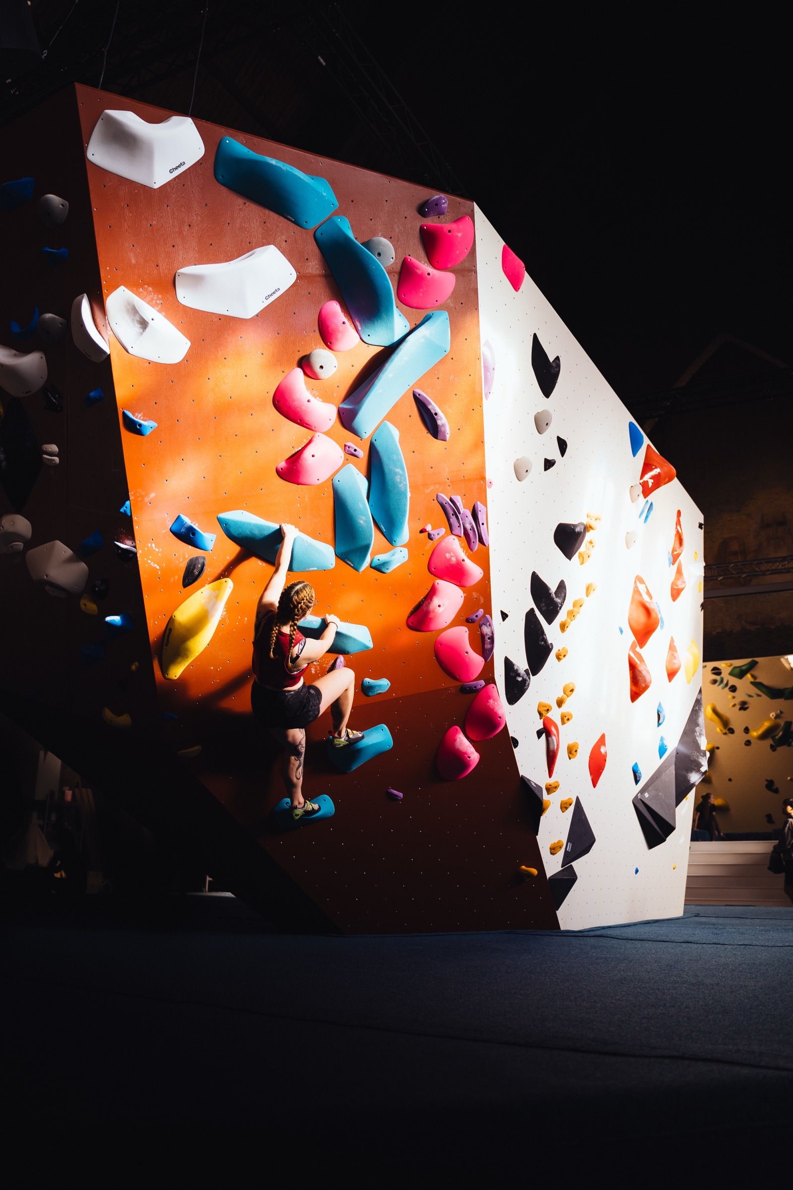 Sunlit climber on a wall at Boulderhal Nirvana